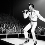**Prompt:** Elvis Presley performing on stage in the 1950s, hip shaking, with a spotlight on him. The background is blurred, suggesting a large crowd. Capture the energy and excitement of early rock and roll.